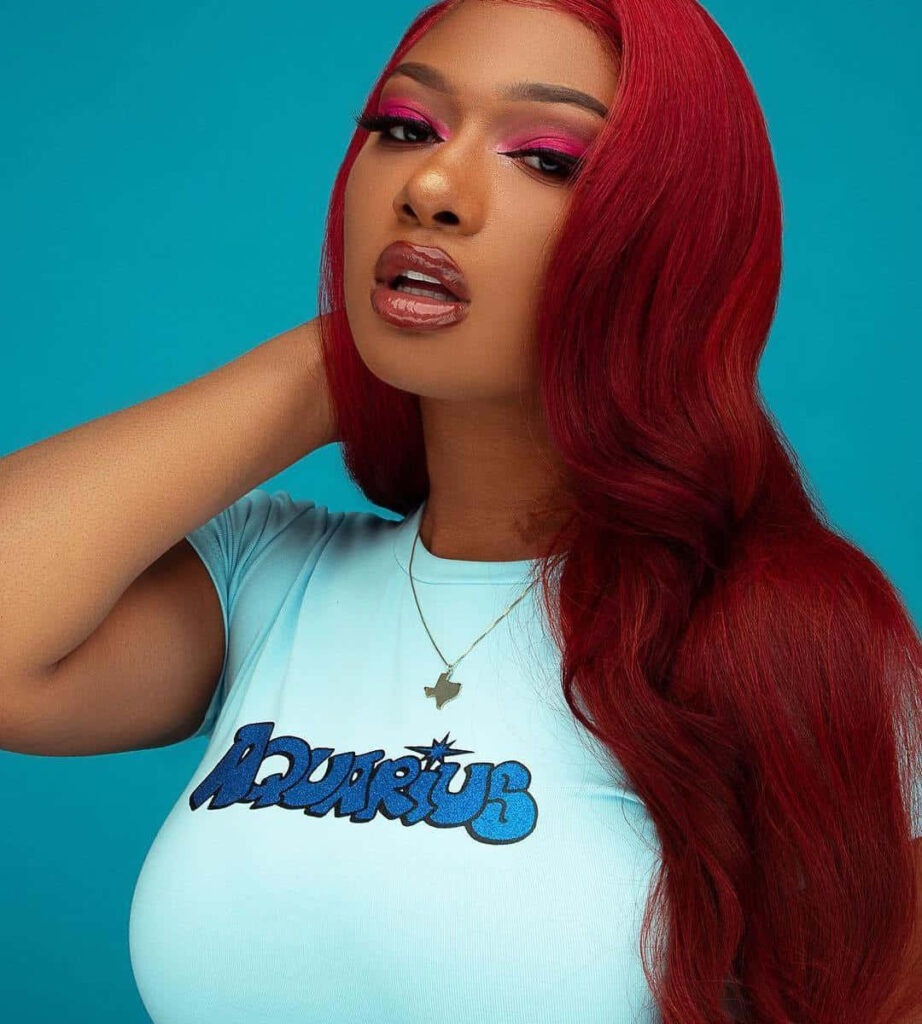 Megan Thee Stallion: Bold Red Hair & Style in Vibrant Wallpaper