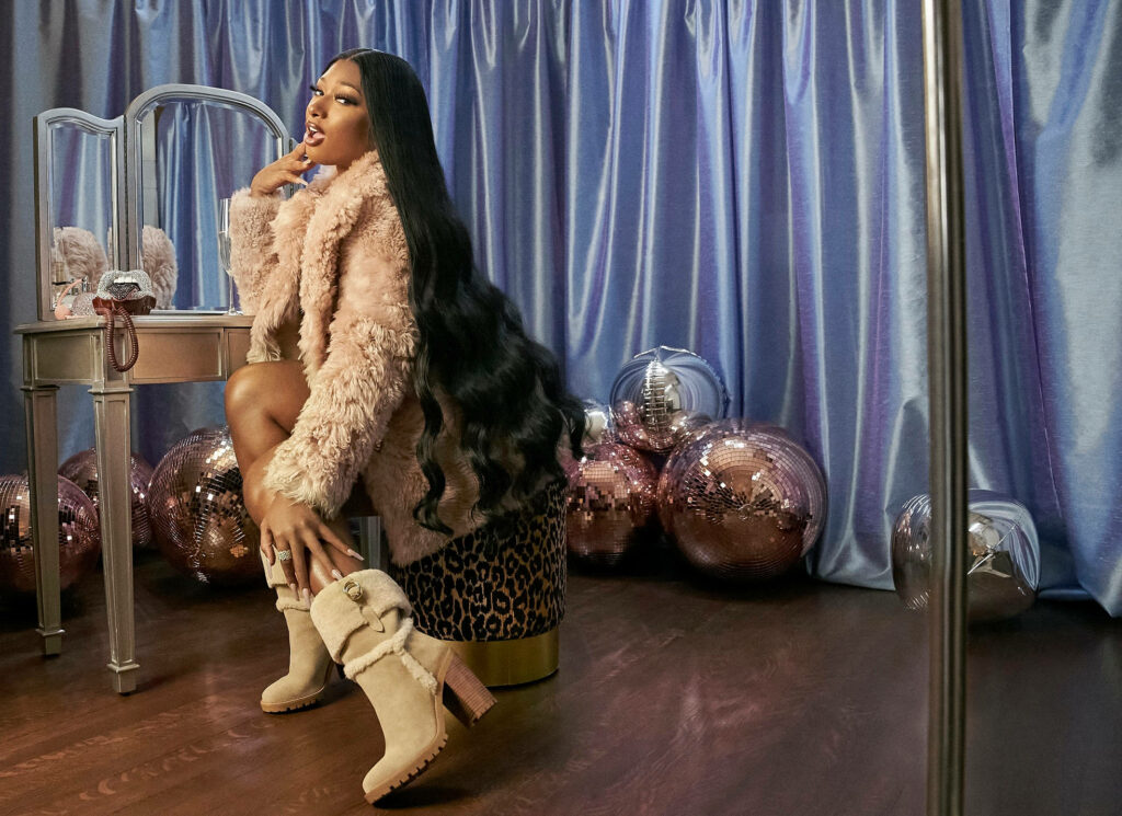 Megan Thee Stallion: Cozy Holiday Glam in Fur Attire Wallpaper