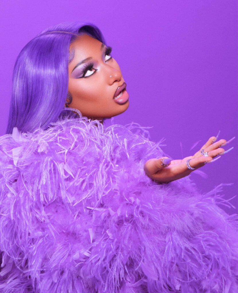 Megan Thee Stallion's Confident Style in Vibrant Purple - Wallpaper