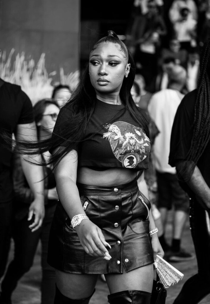 Megan Thee Stallion: Confident Chic in Bold Black Wallpaper