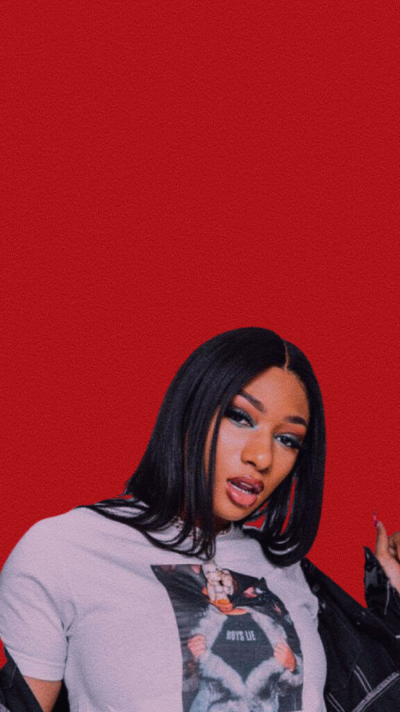 Megan Thee Stallion: Confident & Stylish Wallpaper on Bold Red