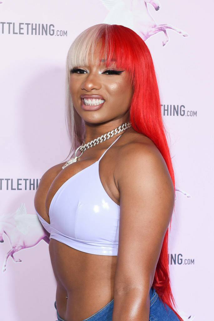 Megan Thee Stallion: Confident in Chic Lavender & Bold Hair Wallpaper