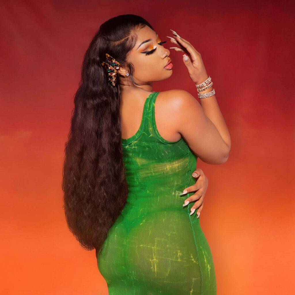 Megan Thee Stallion Shines in Green Dress - Stylish Wallpaper Background