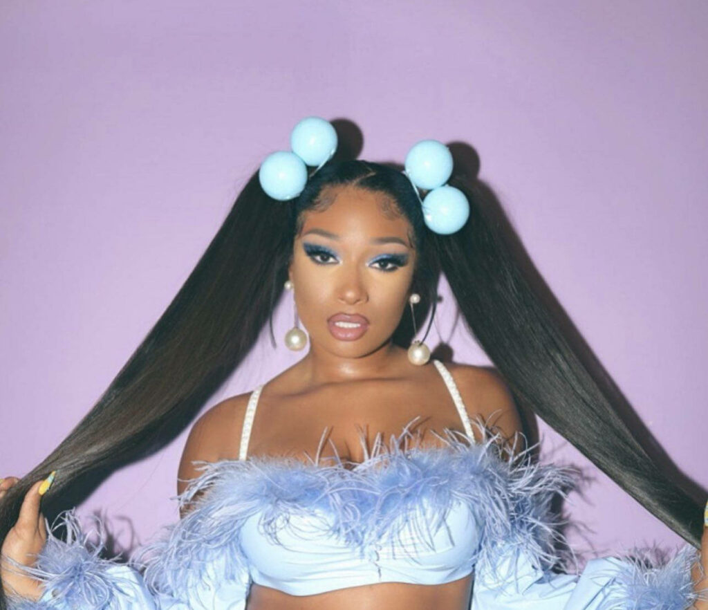 Vibrant Wallpaper: Megan Thee Stallion's Bold Style in Pastel