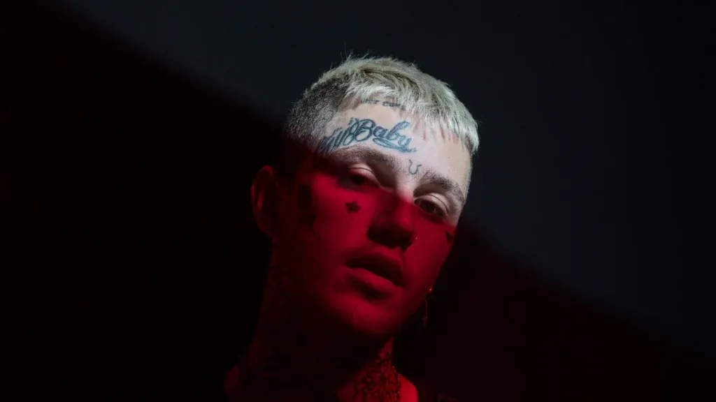 An Eerie Melody: Lil Peep's Enigmatic Musical Persona Illuminates Through a Mesmerizing Dark HD Wallpaper