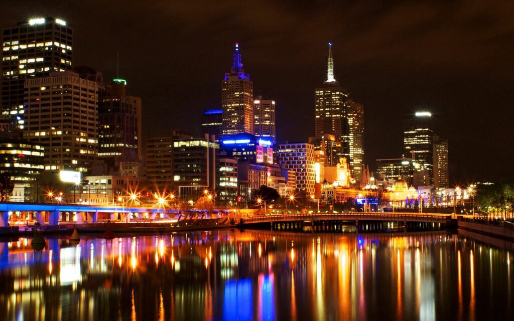 Melbourne Night Cityscape Wallpaper: Illuminated Skyline Reflection