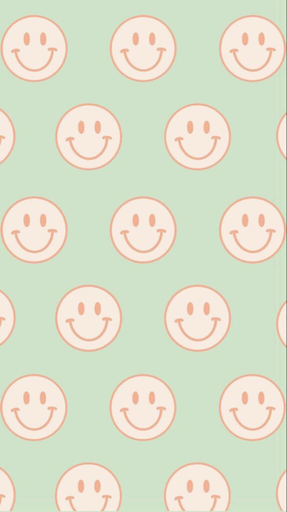 Radiant Preppy Smiles: Vibrant Smiley Faces Dance on a Soft Green Canvas Wallpaper