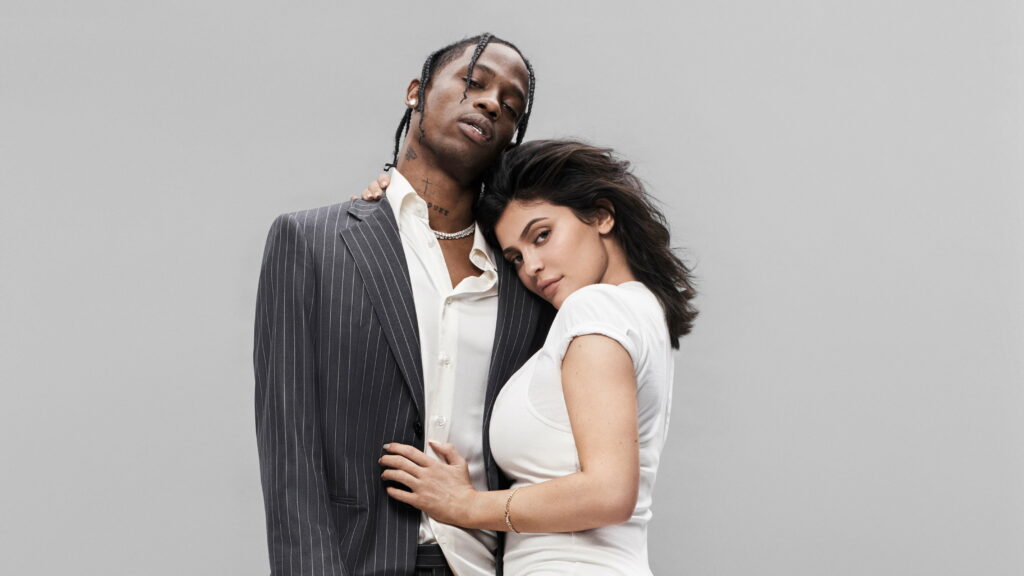 Musical Melody in Motion: Captivating American Rapper Travis Scott and Kylie Jenner in Vibrant 4K Wallpaper