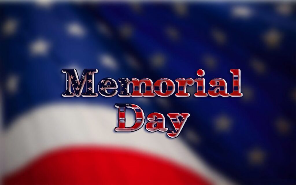 Memorial Day wallpaper with bold text over softly blurred American flag honoring USA heroes