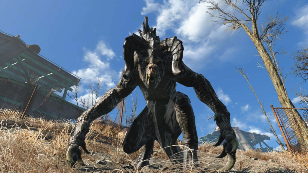 Menacing Fallout Deathclaw with massive claws in barren post-apocalyptic wasteland under blue sky Wallpaper