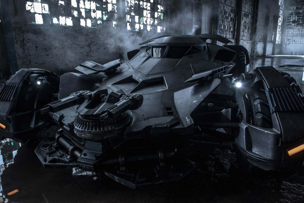 The Menacing Impurity: Batman's Armored Beast Emits Mysterious Fumes Amidst Shattered Panes Wallpaper