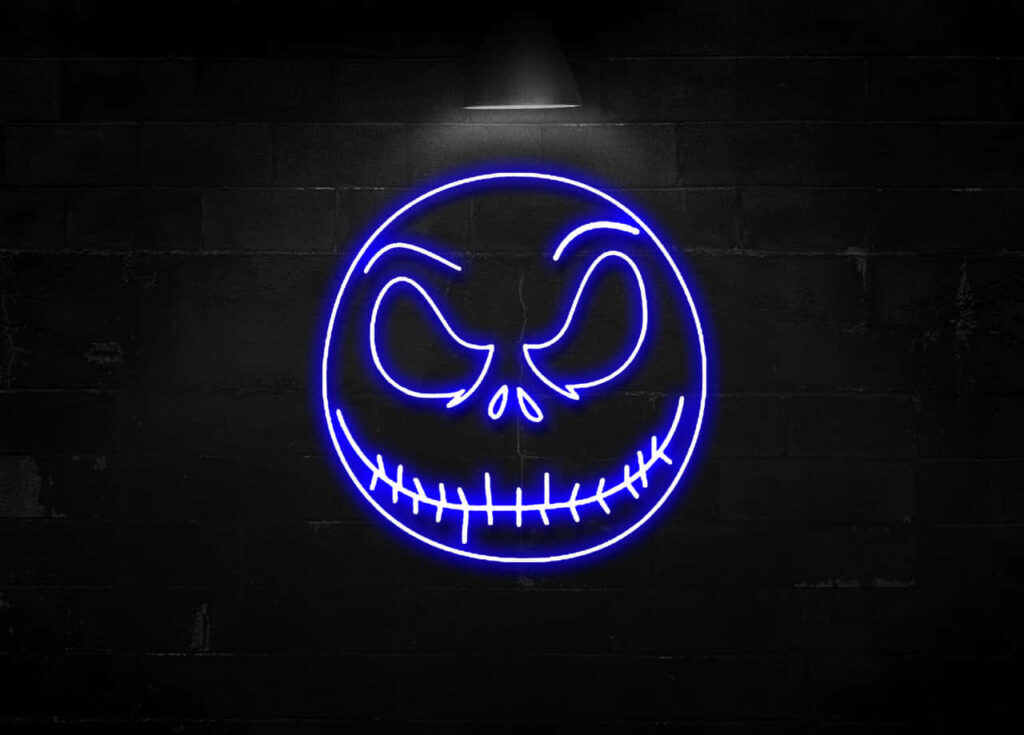 Purple Grinning Halloween Mask Illuminated in Neon Wallpaper