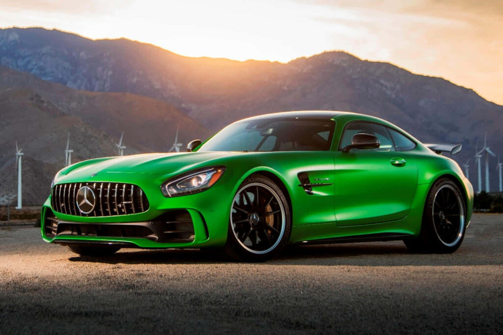 Mercedes AMG GT-R 2018 vibrant green sports car at sunset with mountains and wind turbines background Wallpaper