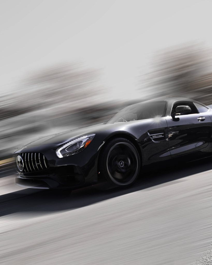 Mercedes-AMG GT R black V8 Biturbo speeding with motion blur dynamic luxury sports car wallpaper