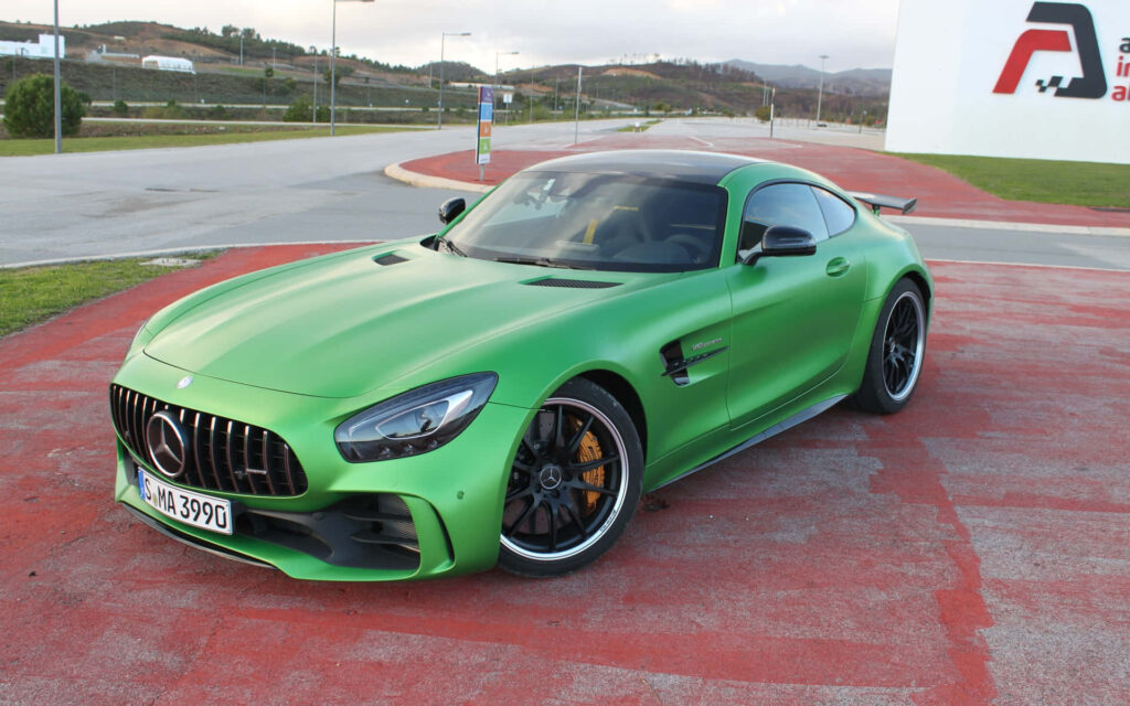 Mercedes AMG GT-R vibrant green parked aggressive design sporty stance premium details wallpaper