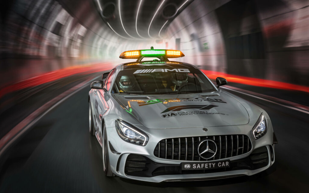 Mercedes-AMG GT R Safety Car speeding through tunnel with bright safety lights and sleek design Wallpaper