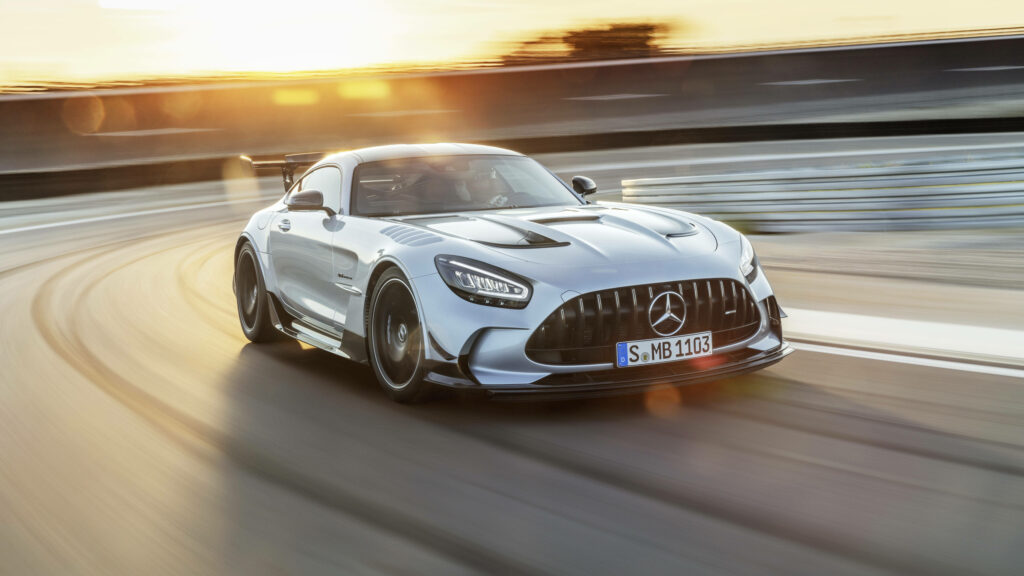 Mercedes AMG GT racing fast on track in vivid 4K ideal for dynamic car laptop wallpaper