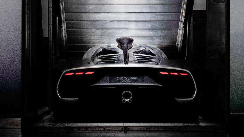 Mercedes AMG ONE supercar at loading bay with aerodynamic design and glowing rear lights wallpaper