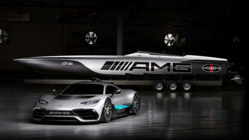 White Mercedes-AMG ONE with AMG speed boat in dimly lit modern garage wallpaper background
