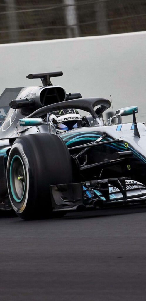 Mercedes AMG Petronas F1 car speeding on track with advanced aerodynamics 2018 season wallpaper