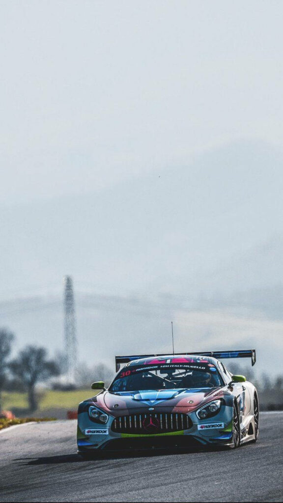 Mercedes-AMG race car speeding on track high performance motorsport adrenaline wallpaper background