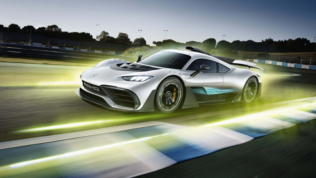 Mercedes AMG racing on track with dynamic yellow light trails for thrilling speed wallpaper background