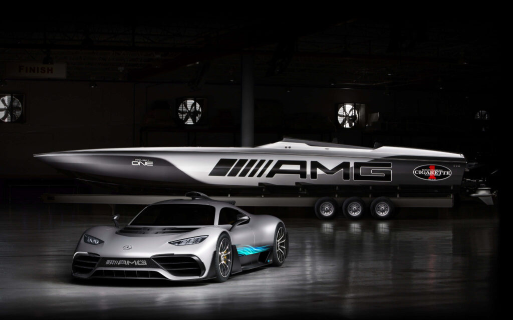 Mercedes AMG sports car and Cigarette Racing speedboat in dim garage high performance wallpaper