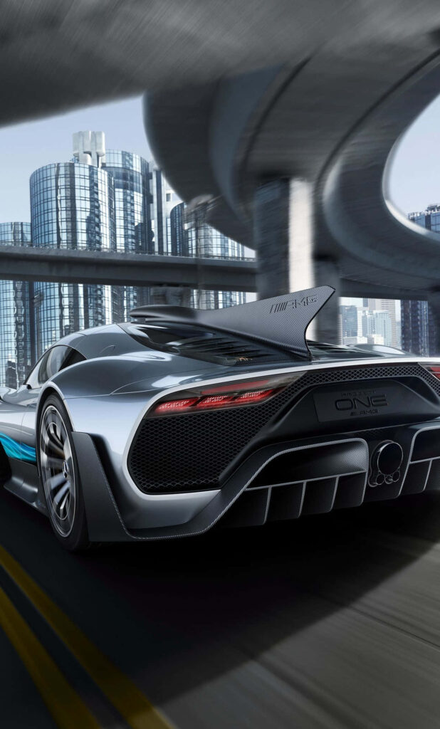 Mercedes AMG driving on urban road with sleek skyscrapers and reflective windows background Wallpaper