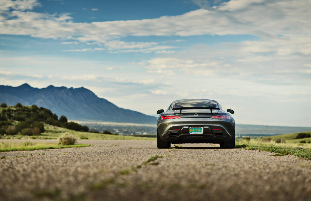 Stunning Mercedes-Benz GTS on Scenic Mountain Road Wallpaper