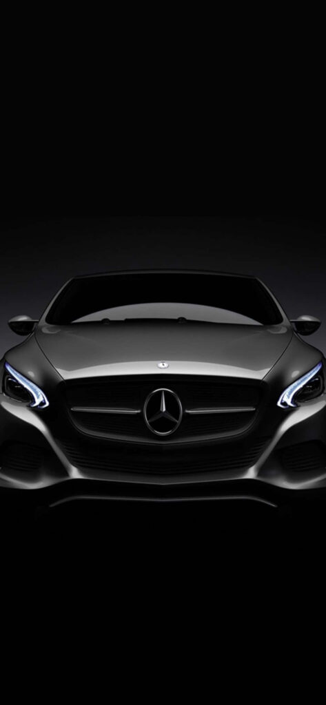 Dark grey Mercedes-Benz S-Class with illuminated grille on black background modern design wallpaper