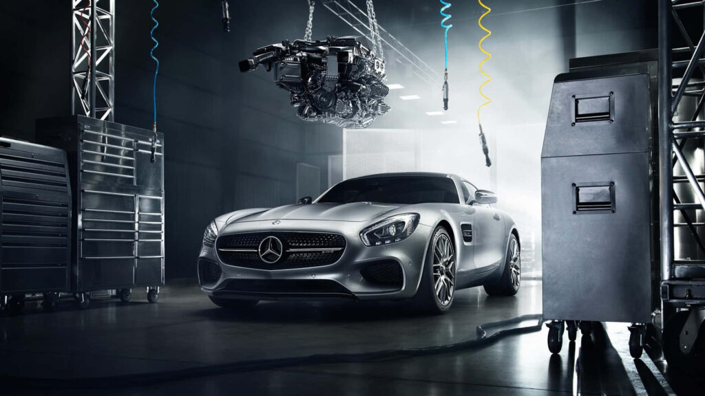 Mercedes-Benz sports car in high-tech garage with dramatic lighting showcasing sleek design Wallpaper