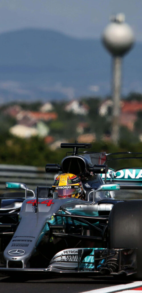 Mercedes F1 2018 racing car speeding on track dynamic wallpaper showcasing aerodynamic design