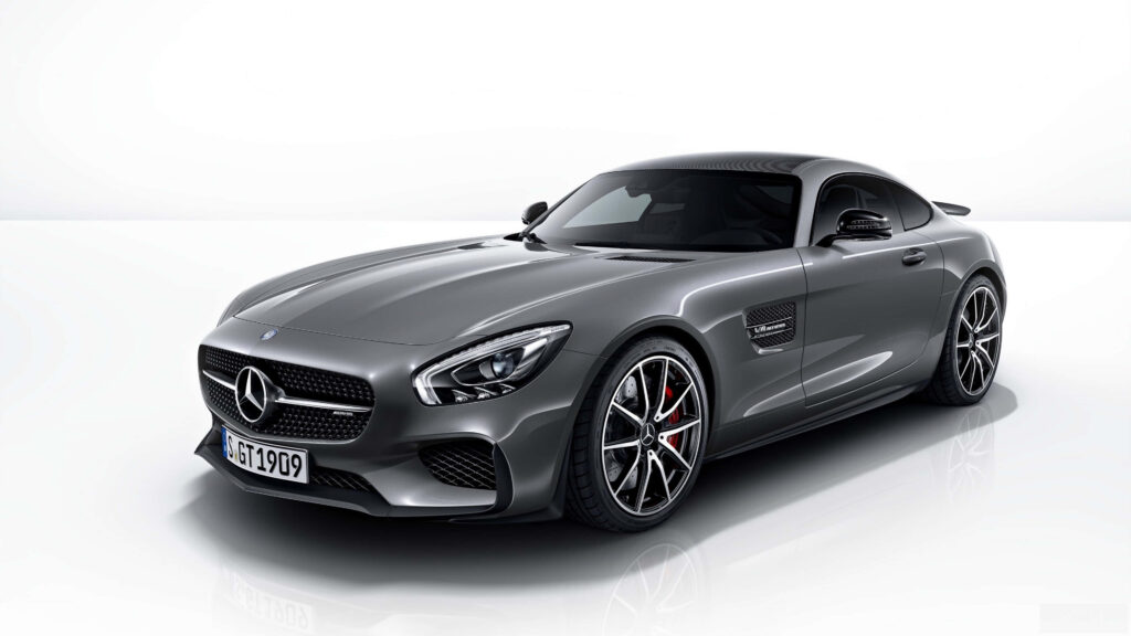 Sleek Mercedes Benz AMG GT in glossy metallic finish showcased in pristine studio 4K wallpaper