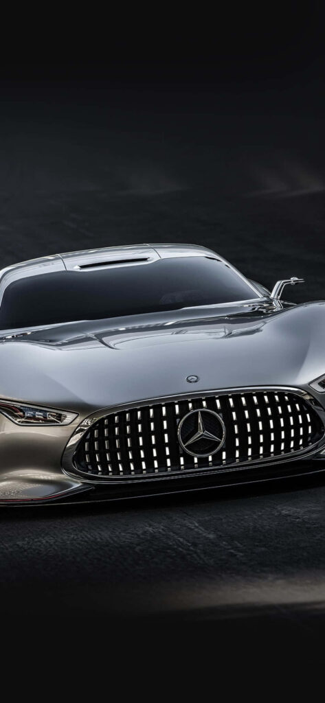 Close-up of Mercedes-Benz AMG Vision Gran Turismo with futuristic design and bold grille on grey background Wallpaper