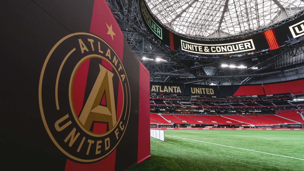 Mercedes-Benz Stadium empty pitch Atlanta United FC crest red seats Unite and Conquer halo board wallpaper