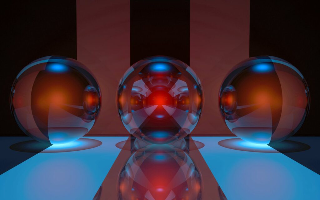 Three Glass Spheres on Reflective Surface with Striped Background Wallpaper