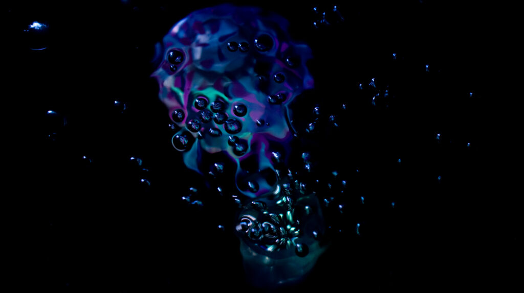 Mesmerizing Bubble Wallpaper: Colorful Abstract Art on Dark Background