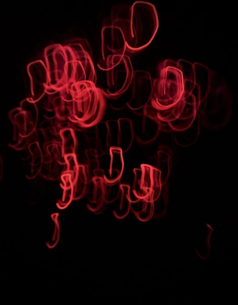 Mesmerizing Abstract Wallpaper: Swirling Red Light Patterns Background