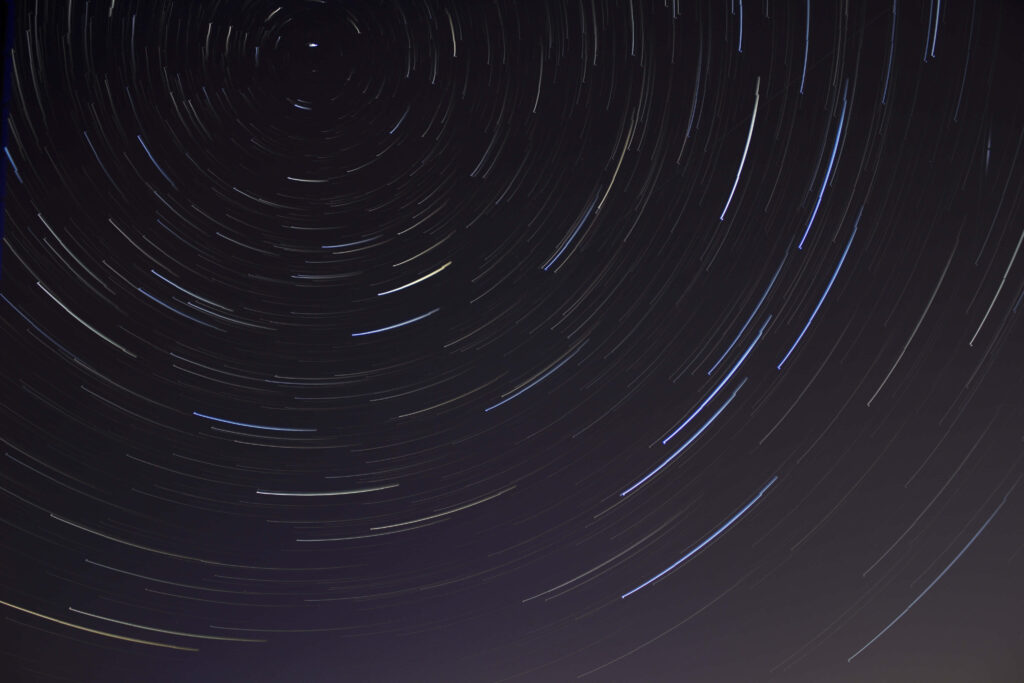 Mesmerizing Star Trails Wallpaper - Dynamic Night Sky Background