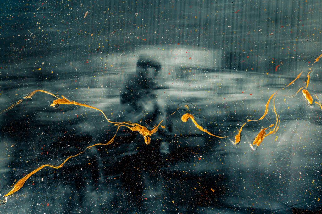 Abstract Wallpaper: Blurred Silhouette Behind Colorful Glass Pane