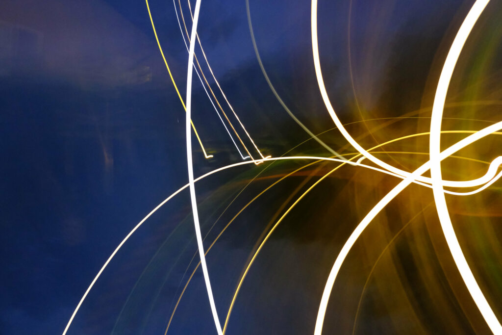 Dynamic Abstract Wallpaper: Glowing Lines & Curves on Dark Background