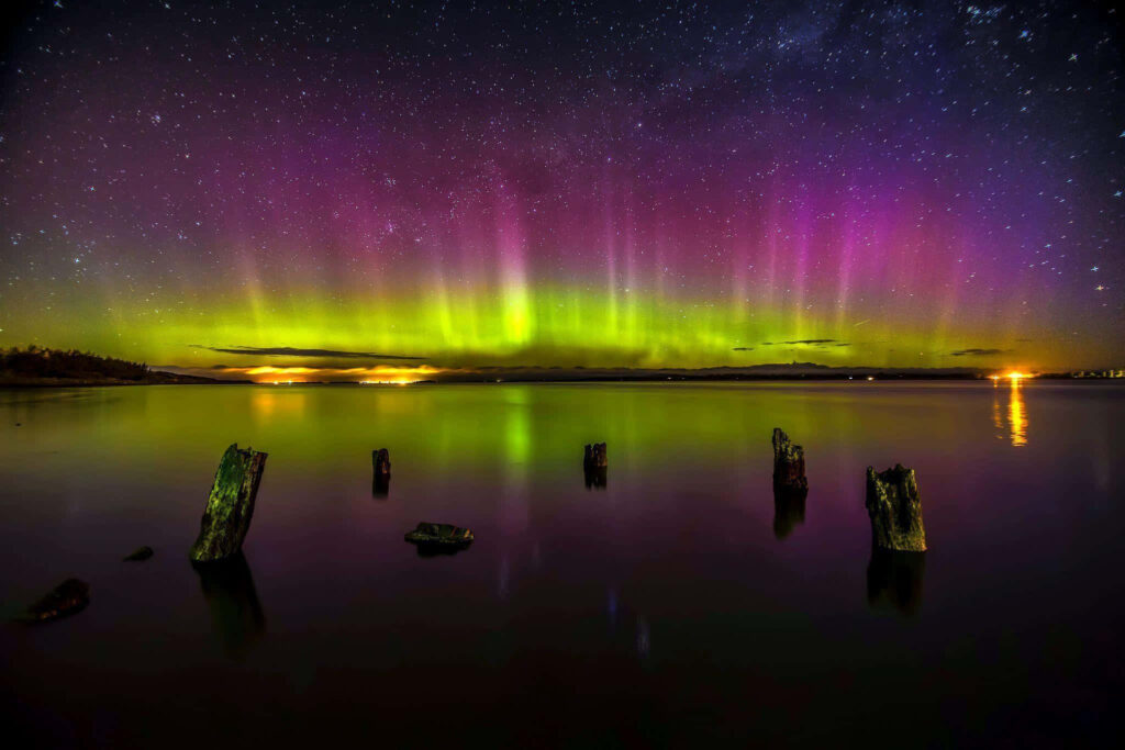 Stunning Aurora Borealis Wallpaper: Green & Purple Night Sky Reflection