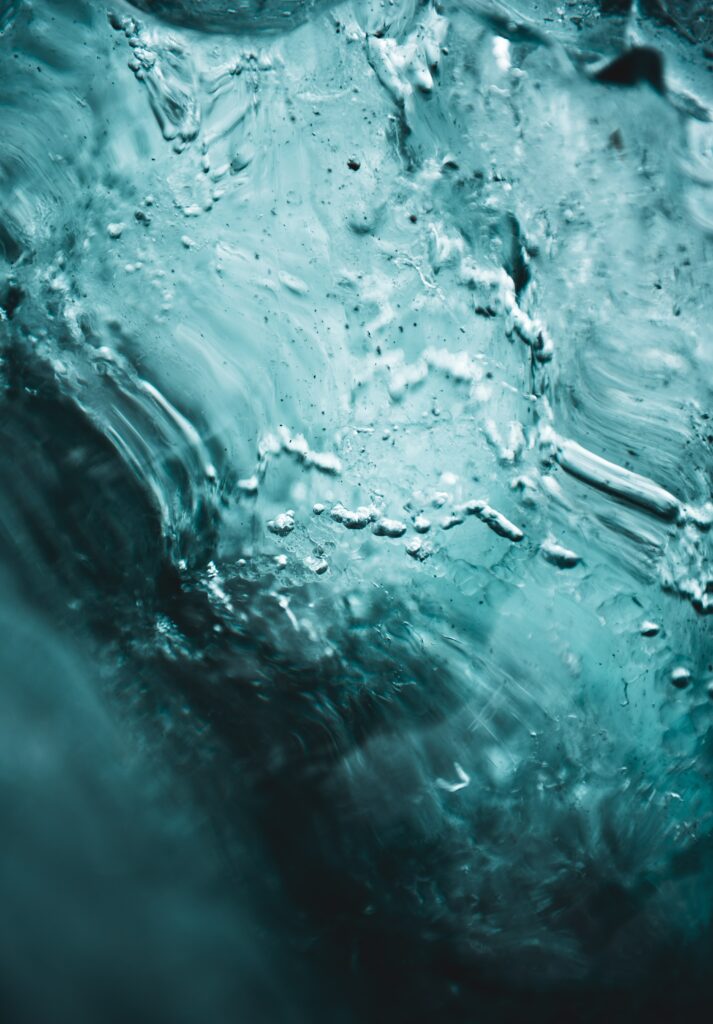 Mesmerizing Blue Ice Macro Shot: Intricate Details & Bubbles Wallpaper