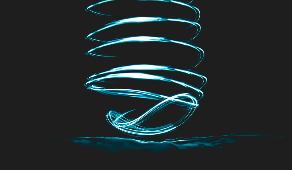 Mesmerizing Blue Light Trails Wallpaper: Artistic Long Exposure Design