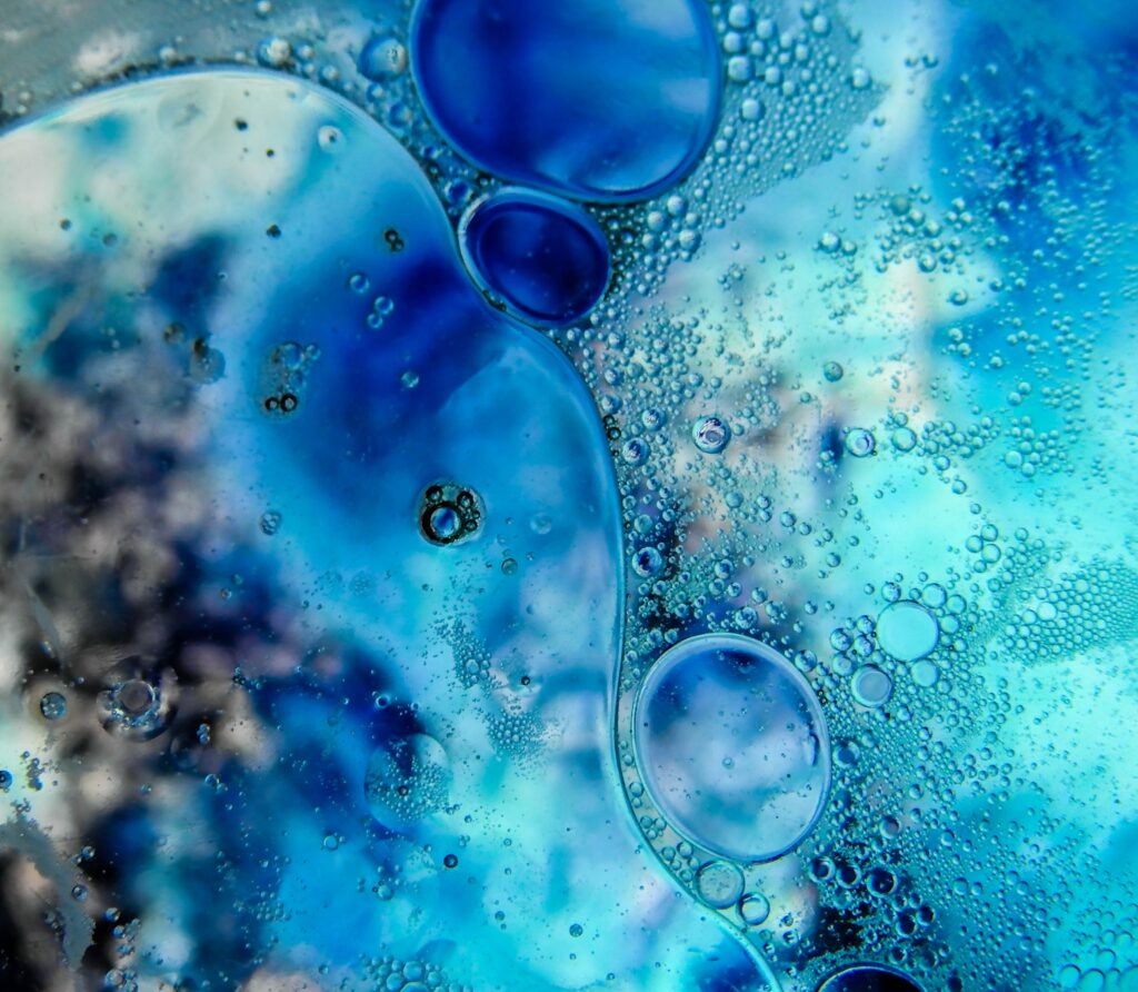 Abstract Blue & Teal Bubble Wallpaper with Liquid Glass Effect
