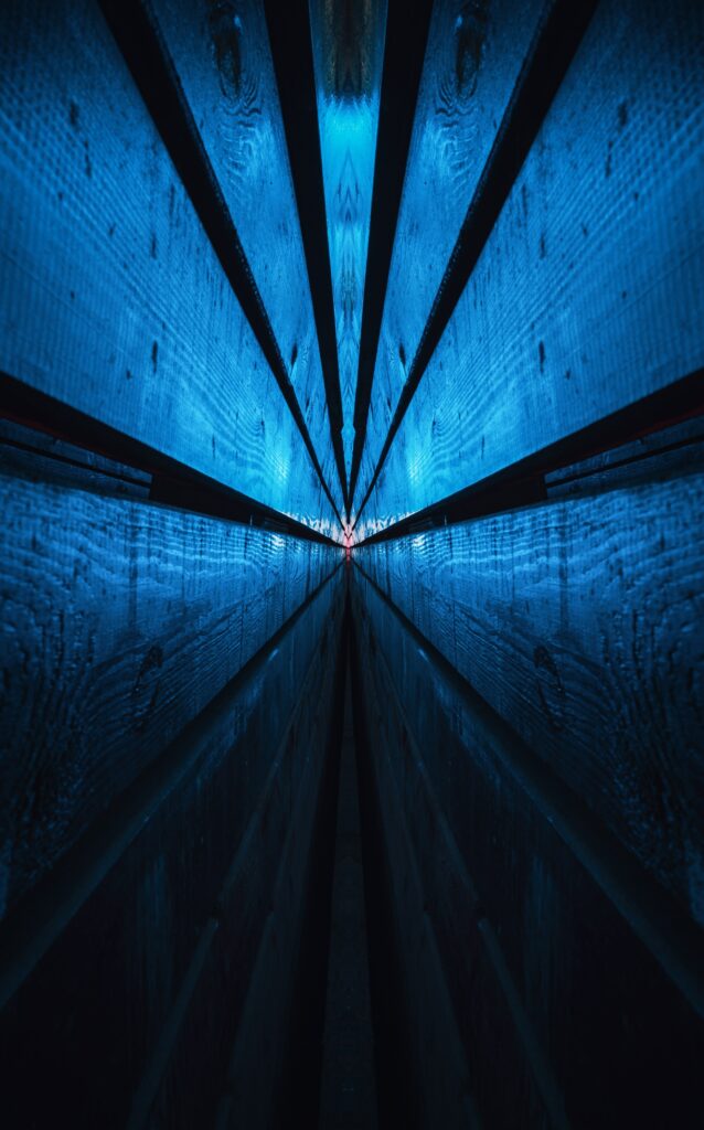 Mesmerizing Blue Tunnel Wallpaper: Abstract Wooden Reflection Background