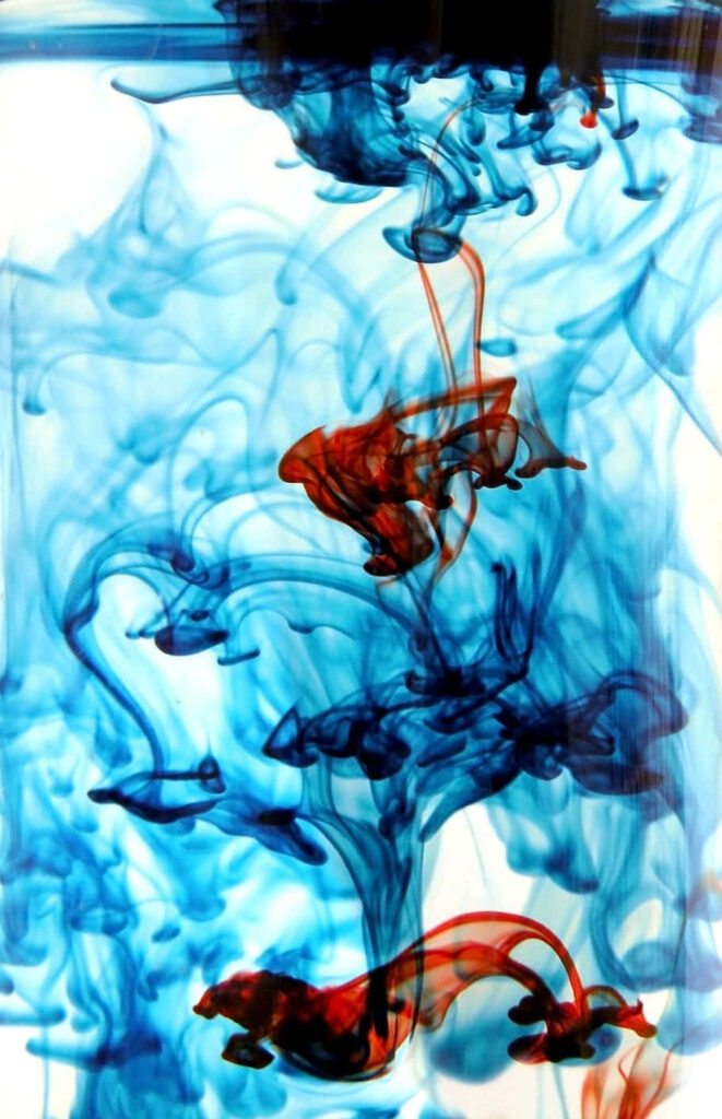Mesmerizing Blue and Red Ink Swirl Wallpaper Background