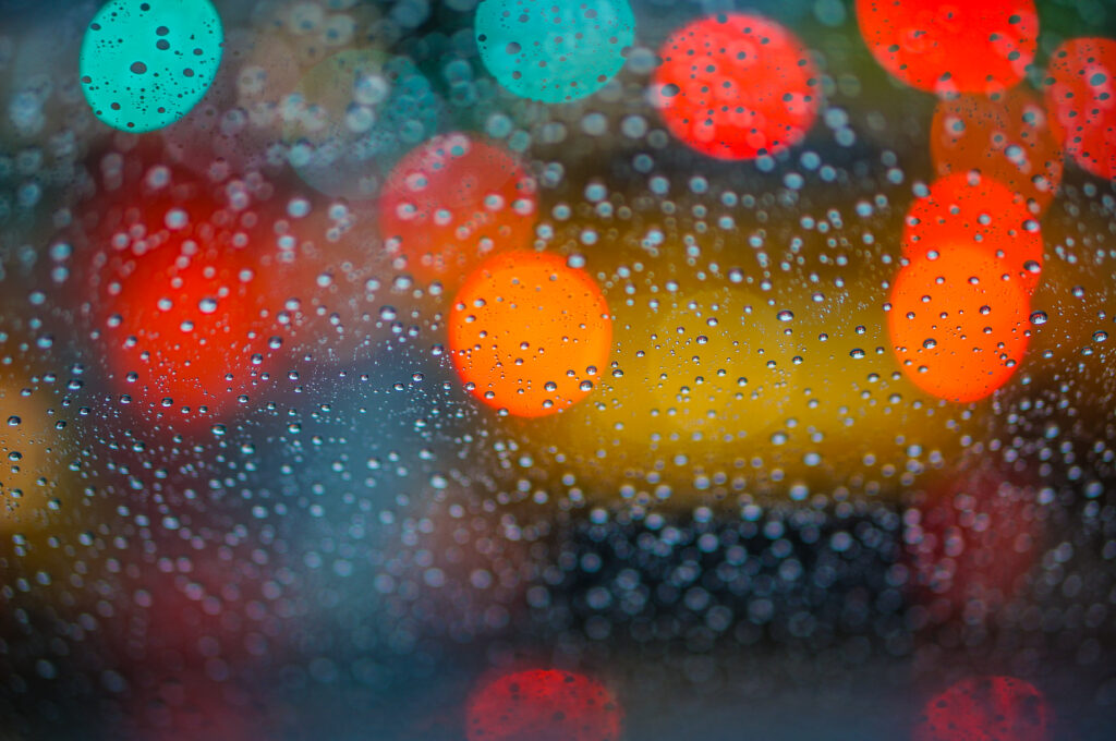 Mesmerizing Bokeh Lighting Wallpaper with Water Droplets Background
