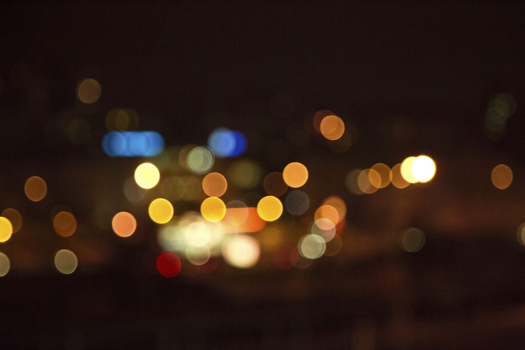 Warm Bokeh Wallpaper: Mesmerizing Light Pattern on Dark Background