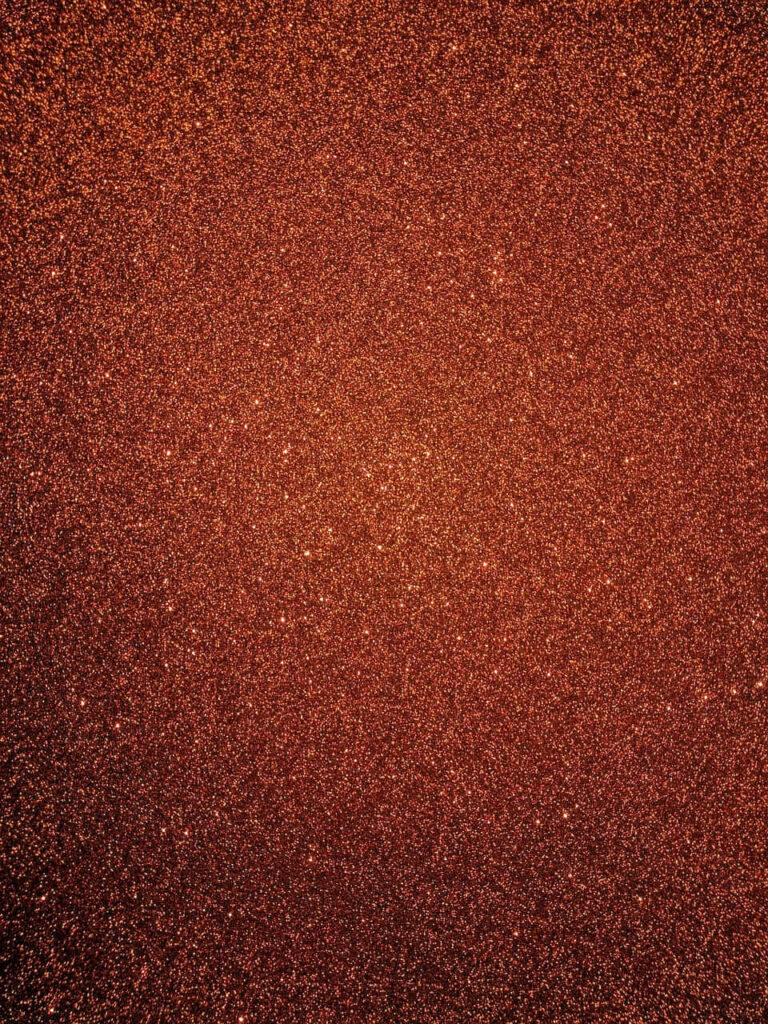 Mesmerizing Burnt Orange Background with Glittery Particle Texture Wallpaper